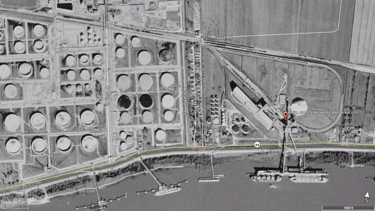 Satellite image showing the community of Lions between the Marathon Refinery and Cargill's grain elevator.
